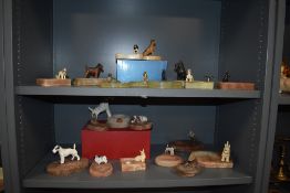 A large collection of Art Deco ash trays, all having cast and gold plated metal dog decoration,