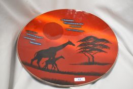 A large Poole pottery African sky charger, having unusual Giraffe design, marked to reverse with