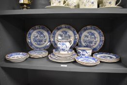 A selection of early 20th century blue and white table ware, to include, graduated plates, sugar