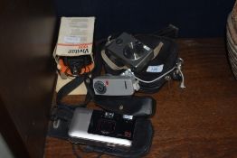 A selection of cameras and accessories, including Canon digital IXUS, a vintage GINO compact III