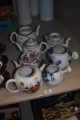 Seven antique teapots, including 18th century porcelain, two Japanese examples and similar.