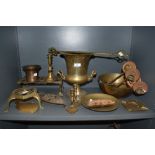 An 18th century bell metal mortar sold with a collection of brass including trivets, candlesticks,