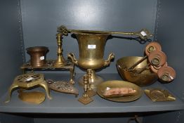 An 18th century bell metal mortar sold with a collection of brass including trivets, candlesticks,