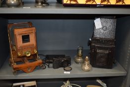 A collection of antique field/ plate camera and similar parts.