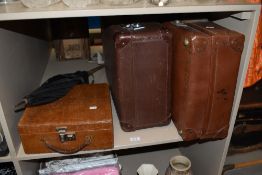 Two vintage suitcase and a mock crocodile vanity case.