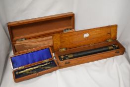 A mahogany cased set of surveyors/architects curves, the hinged cover with inset brass plaque