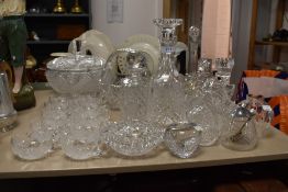 A large collection of cut glass and similar, including decanters, flower baskets, punch mugs and