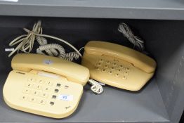 Two retro Betacom telephones.