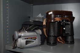 A pair of vintage Janek Binoculars in case and a JVC camcorder.
