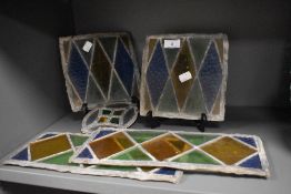 A group of five antique leaded and coloured glass panels