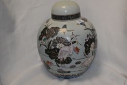 A large Oriental style ginger jar, having decoration of storks and other birds, flowers and sea,