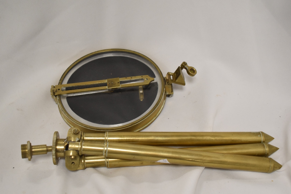 An interesting brass cased prismatic compass with brass tripod (AF) unmarked