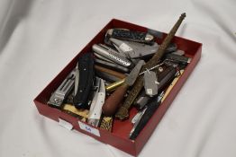 A collection of vintage pen knives and multi tools, etc.