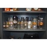 An impressive collection of antique apothecary/ chemists bottles, many having original labels.