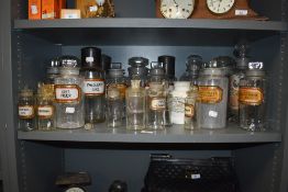 An impressive collection of antique apothecary/ chemists bottles, many having original labels.