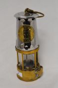 A brass and chromed metal miners safety lamp, number 224, 'The Protector Lamp Lighting Co Ltd' 25cm