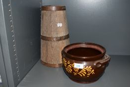 A Wetheriggs Penrith pottery tureen void of lid, having brown ground with yellow pattern, and a