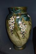 A large 20th century floor vase, having mottled green tone glaze with gilt accents and hand