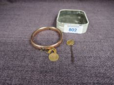 A 9ct Gold Bangle marked 9ct with an American One Dollar Gold Coin having Indian Head along with a