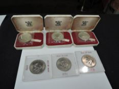 Three 1970 Royal Mint Isle of Man Silver Proof Crowns, all cased and three Isle of Man One Crown