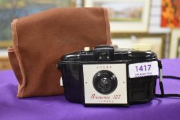 A vintage Kodak Brownie 127 camera and case