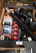 A box of various flashguns and tripods