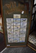 Two sets of framed HO Wills cigarette cards showing vintage cars and aeroplanes.