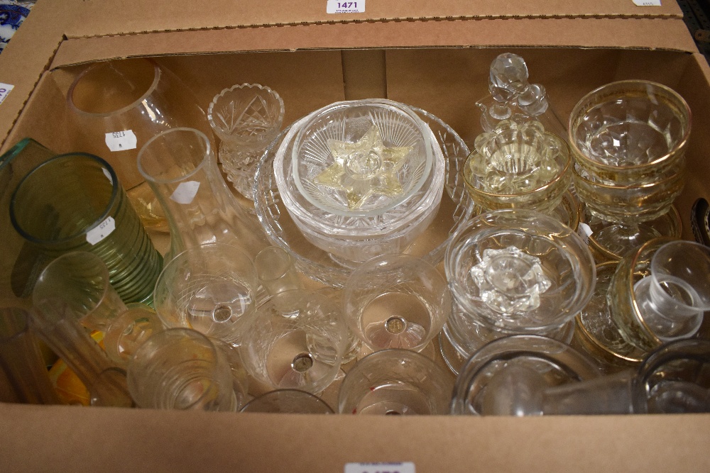 A selection of glass items including champagne glasses, desert dishes, crystal bowl and three