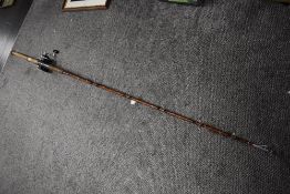 Two Vintage boat fishing rods one unmarked and a Shakespeare seamaster 1406 with a Daiwa Sealine