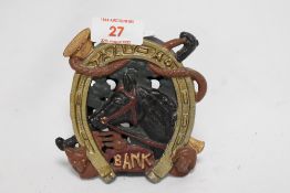 A novelty cast metal money bank, of racehorse theme, and measuring 12cm tall