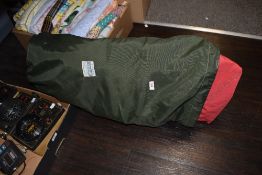 Two vintage dinghy sales, small and large, within a green sack