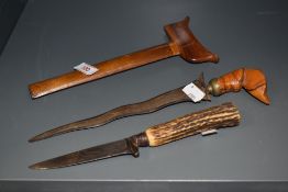 An Indonesian kris dagger, with distinctive wavy blade, and associated scabbard, 27cm long, together