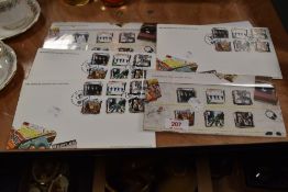 A group of seven The Beatles Royal Mail First Day Covers and a small number of loose stamps of World