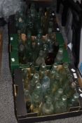 Two boxes of glass codd bottles and other bottles, including Hanson & Mitchell Ossett, T.Windebank