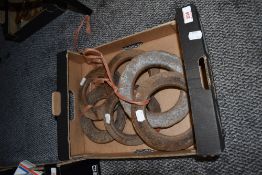 A box of traditional metal quoits