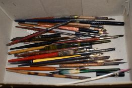 A collection of various dipping pens and quill pen