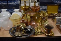 An assorted group of copper and brass metalware, to include a planished copper bowl, trivets,