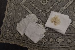An assortment of antique table linen, including cut work, drawn thread work and crochet.