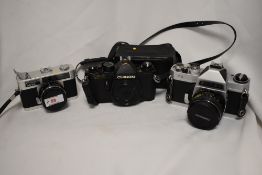 Three Chinon cameras. A Chinon CE-3 camera body No162074 and a Chinon35EE camera No105946 with a
