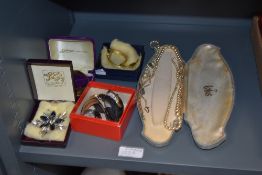 A selection of costume jewellery including pearl necklace, watches, broach etc