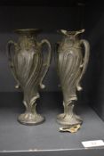 A pair of 19th Century Art Nouveau spelter twin handled vases of small proportions, measuring 19cm