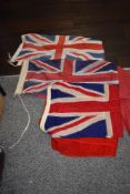 Three vintage red Ensign flags, of different sizes