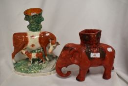 A Chinese red ground elephant vase together with a 19th Century Staffordshire porcelain vase,
