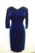 A 1960s midnight blue velvet wiggle dress, medium size.