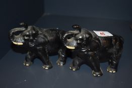 A pair of Sylvac pottery matte black elephant ornaments, with impressed 768 marks to the