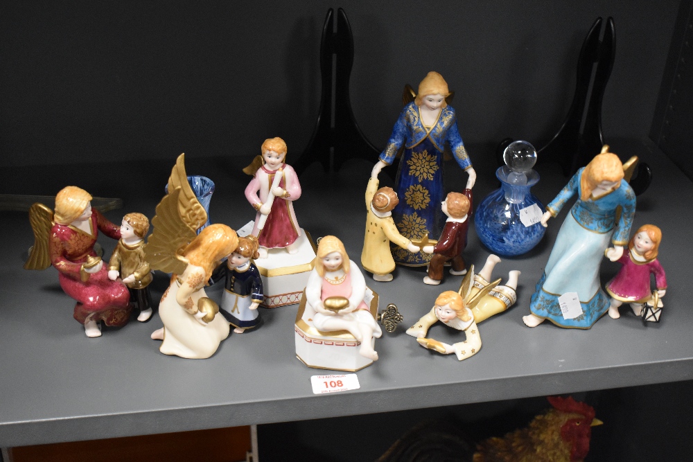A group of seven Villeroy & Boch porcelain Angell di Natale angel ornaments, and two Caithness glass