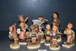 A group of 10 West German Hummel porcelain ornaments, the largest measuring 14cm tall