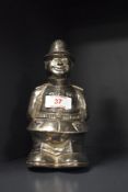 A vintage novelty cast metal money bank, mid-20th Century, and modelled as a policeman, 19cm tall