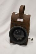 An early 20th Century cast iron railway lantern, with glass bevelled sides, and measuring 29cm tall