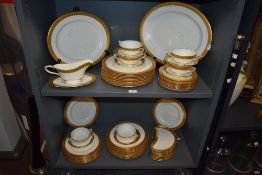 A quantity of Royal Worcester Davenham style patterned dinnerware, with gold coloured trim on